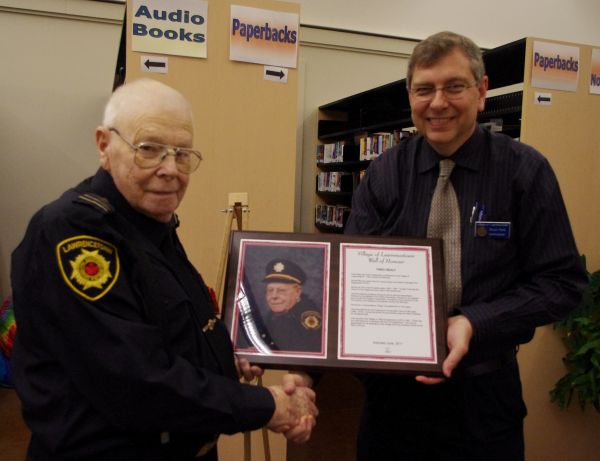 JamesInducted June 2011 ~ Fred Healy accepting his plaque from Commission Chair Brian Reid.