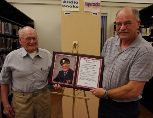 CharlesInducted June 2011 ~ Charlie Whitman accepting his plaque from Commission Vice Chair Dave Spears